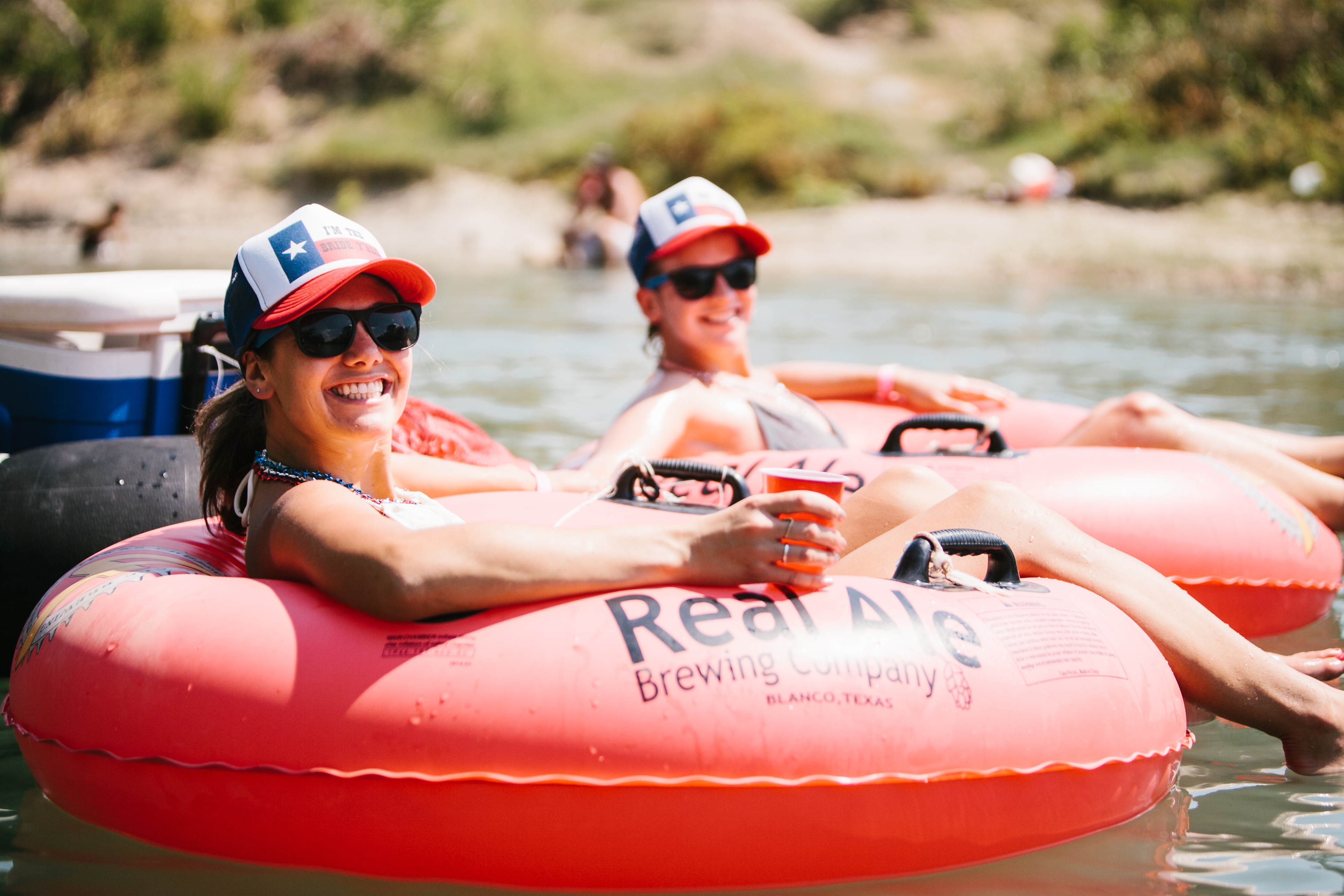 Girls floating on the San Marcos River