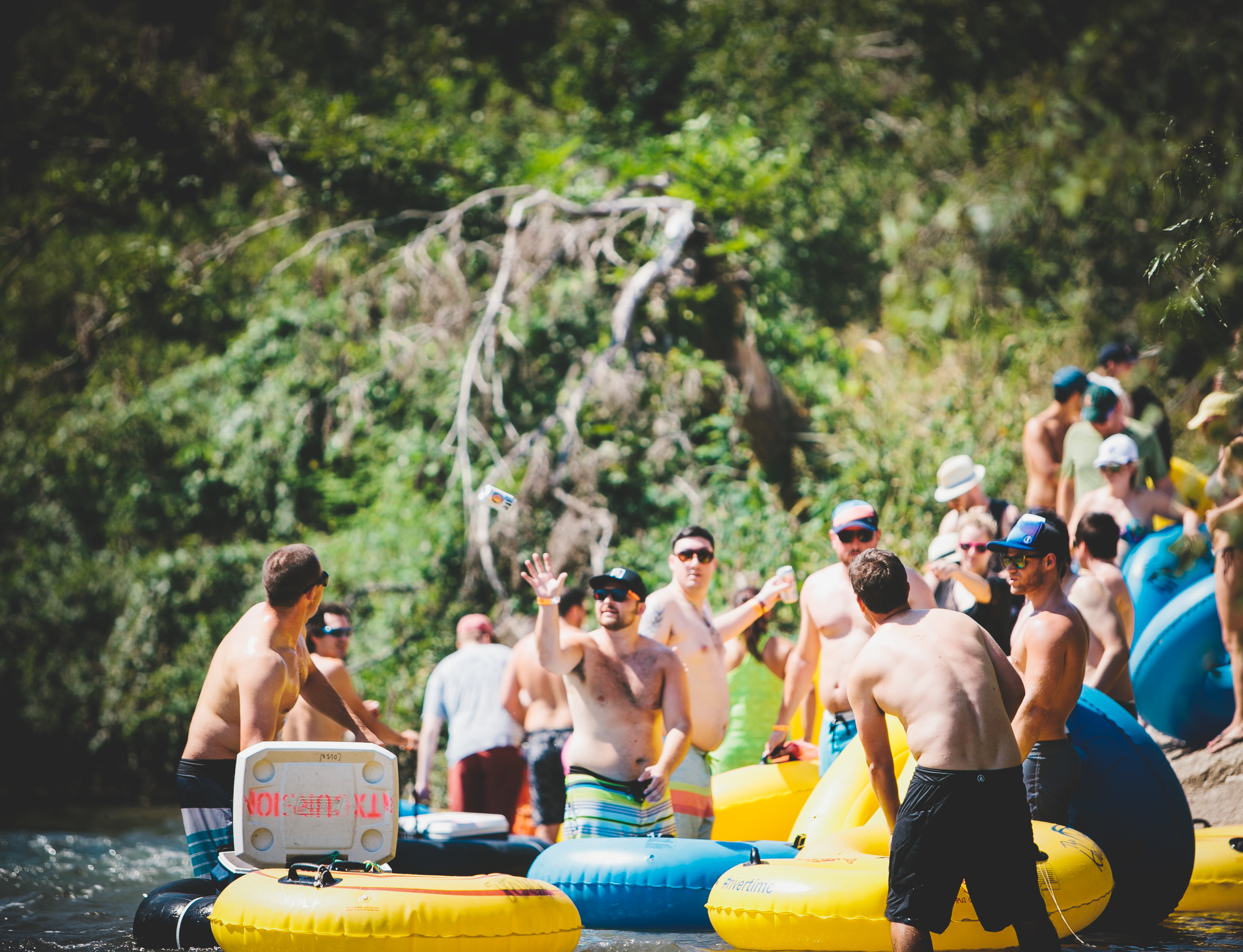 Man throwing a beer to another man