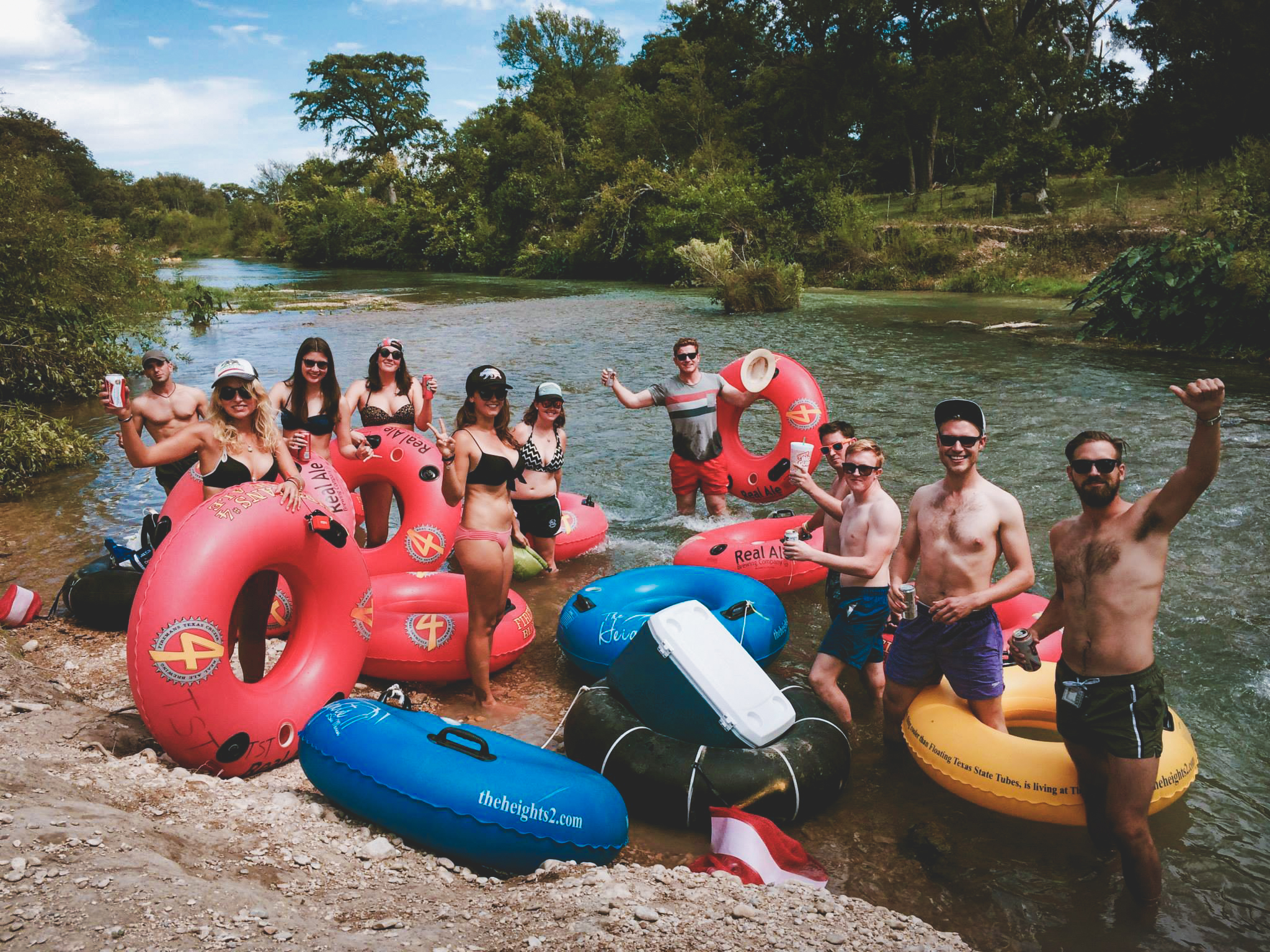 Group of guys and girls tubing